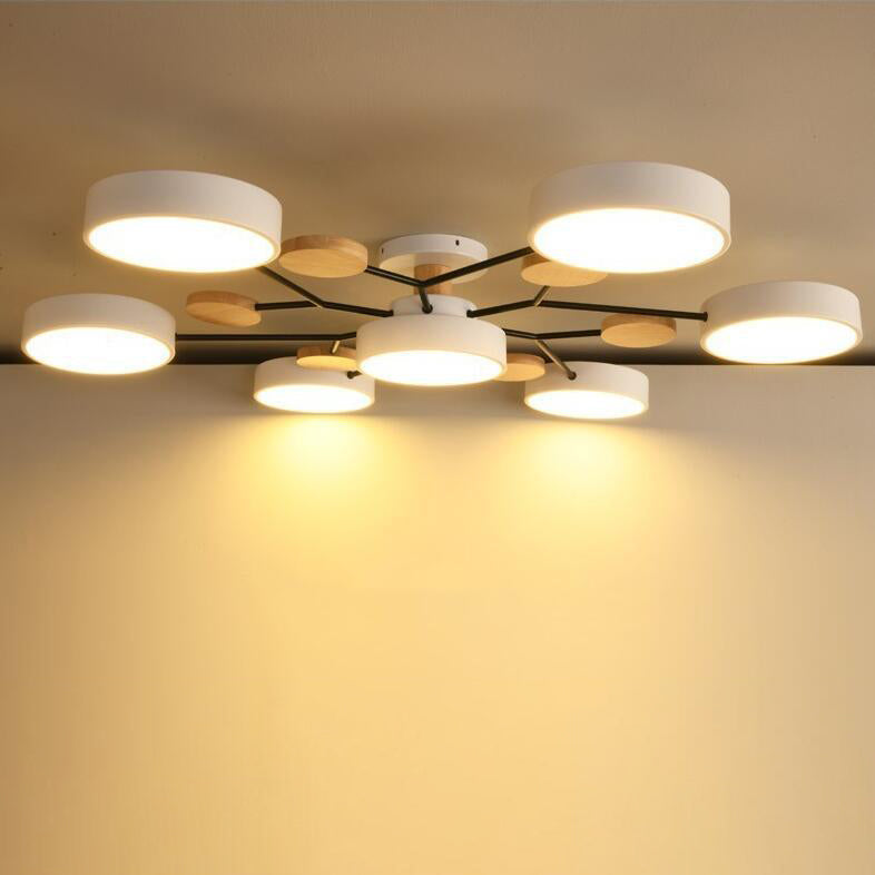 Branch ceiling light glowing warm white across a ceiling, LED discs lit — Casa Norex