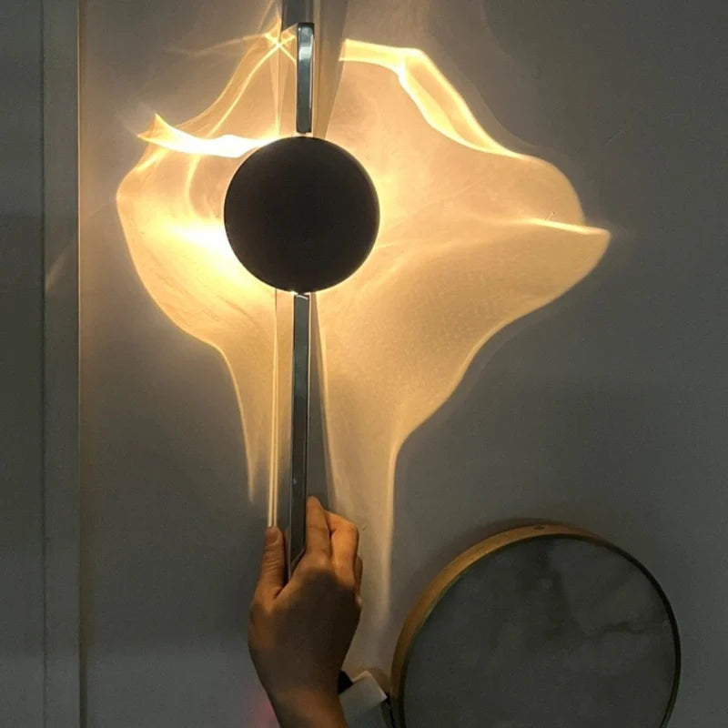Hand turning the rotatable head of the Solo wall sconce, 180° adjustable angle — Casa Norex