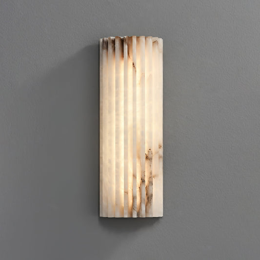 Wall sconce in bedroom setting — soft ambient stone glow | Casa Norex