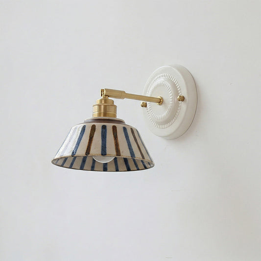 Wall sconce in bedroom setting — warm bedside light | Casa Norex