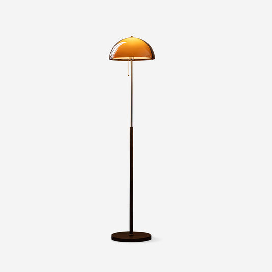 Rustina floor lamp beside reading chair - golden warmth - Casa Norex