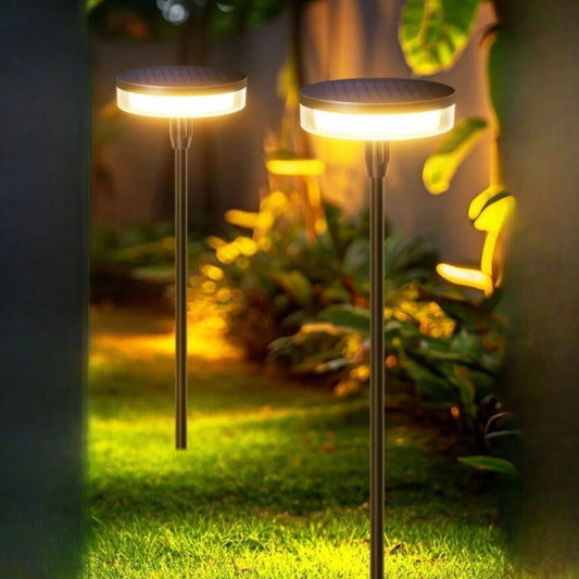 Solar swaying garden stake pathway light in a flower bed