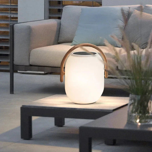 Solar lantern in patio setting — warm ambient glow at dusk | Casa Norex