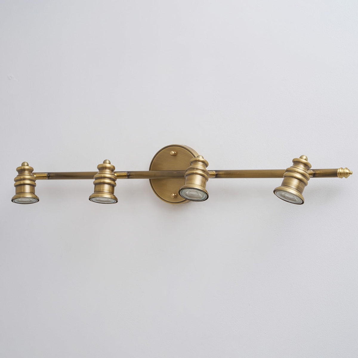 Macro view of a brass spotlight head at the end of the bar — Casa Norex