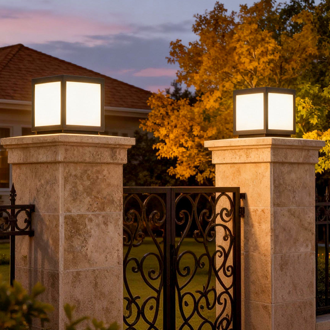 Garrick pillar lights on stone columns at a gated entrance — Casa Norex