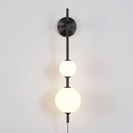 Vertical Globe wall lamp in modern living room setting - Casa Norex