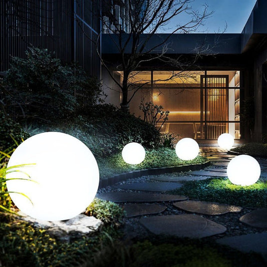 Globe light in patio setting — glowing accent lighting at night | Casa Norex