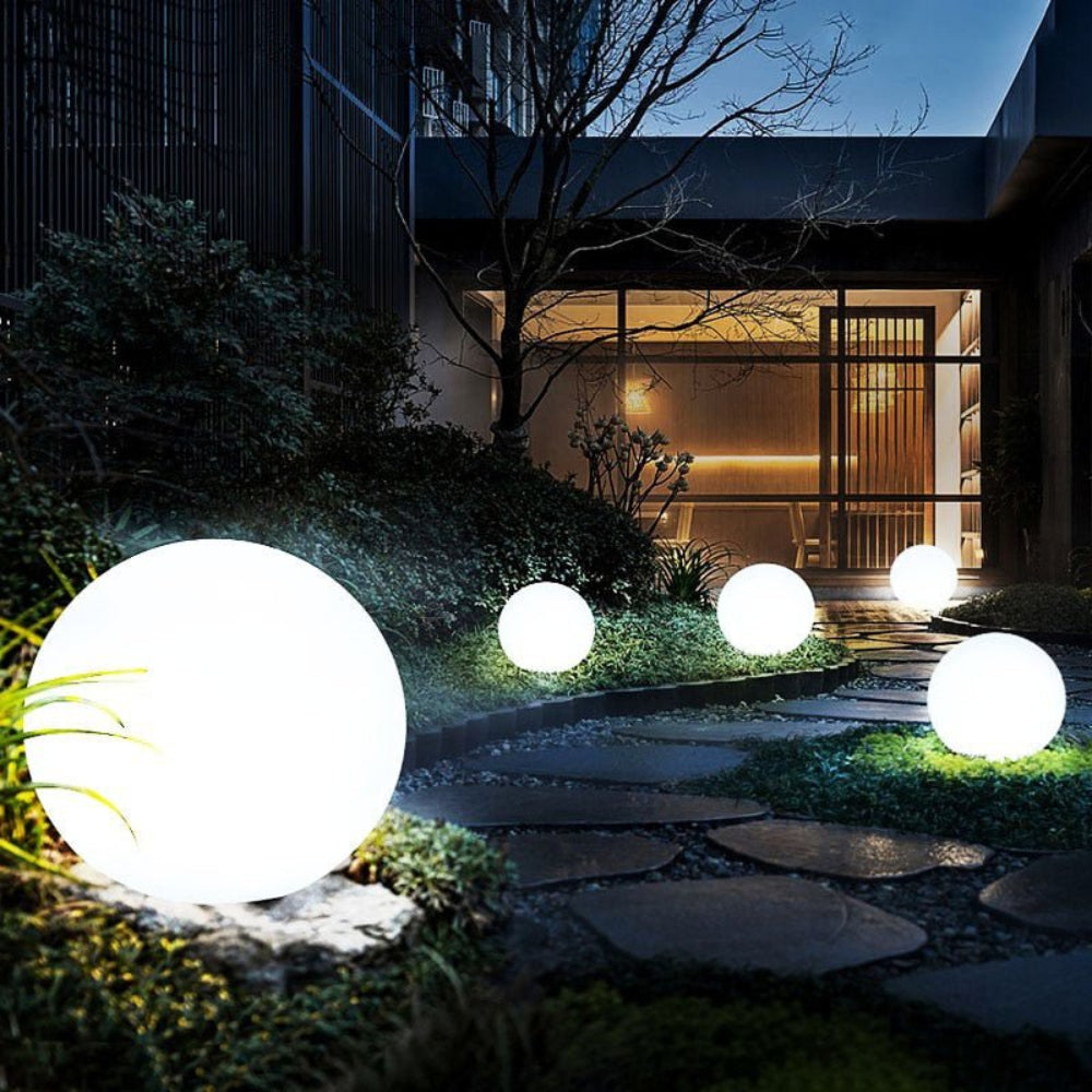 Globe light in patio setting — glowing accent lighting at night | Casa Norex