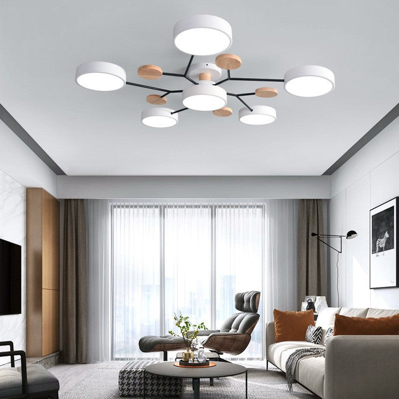 White branch ceiling light in a gray living room with armchairs — Casa Norex