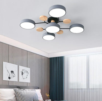 Gray 5-light branch ceiling light in a bedroom with paneled wall and curtains — Casa Norex