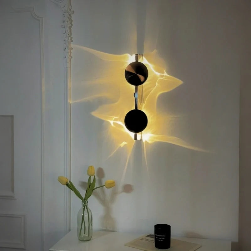 Duo wall sconce above a white console with tulips in a vase, ripple light on the wall — Casa Norex