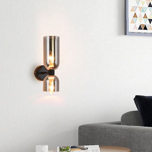 Cylindrical glass wall sconce — dual clear glass shades on iron frame | Casa Norex