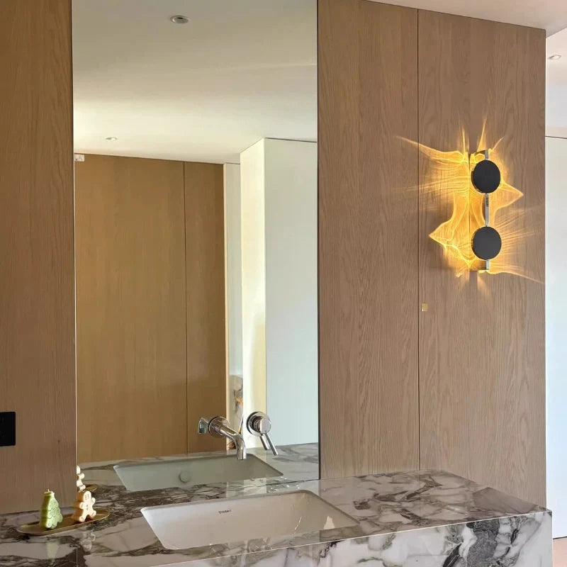 Duo wall sconce on a wood-paneled wall next to a marble vanity and mirror — Casa Norex