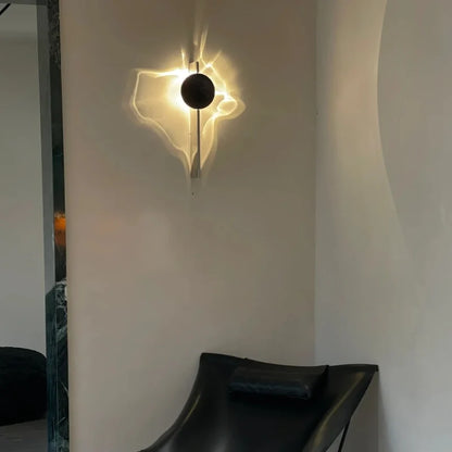 Solo wall sconce on a gray wall above a black leather chair in a corner — Casa Norex
