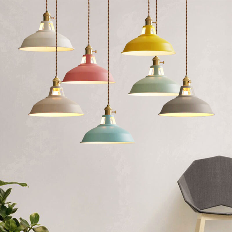A cluster of colorful barn shade pendant lights at different heights with brass sockets | Casa Norex