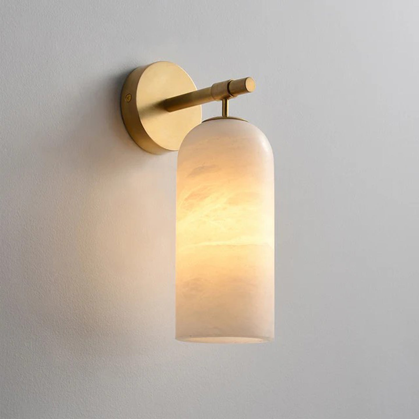 Pillar alabaster wall sconce — translucent stone with gold arm | Casa Norex