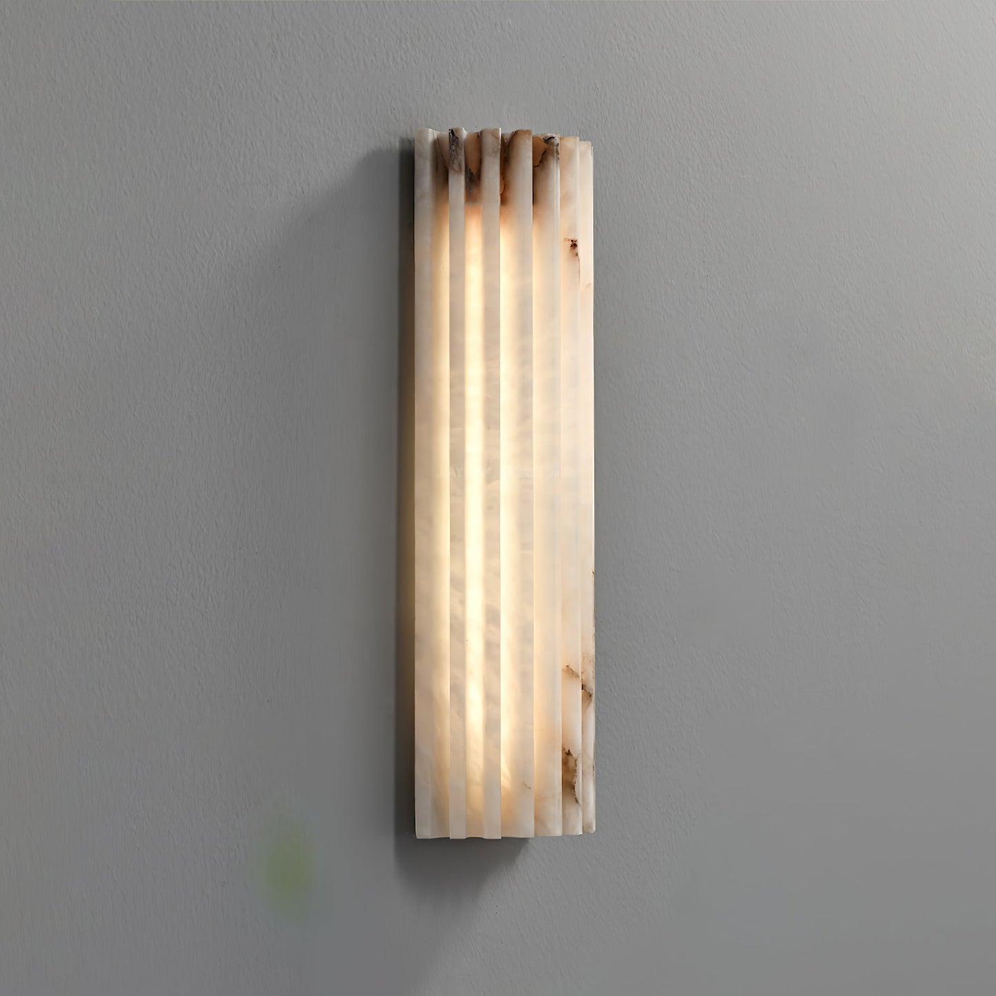 Close-up of ribbed alabaster texture on wall sconce | Casa Norex