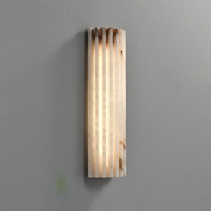 Close-up of ribbed alabaster texture on wall sconce | Casa Norex