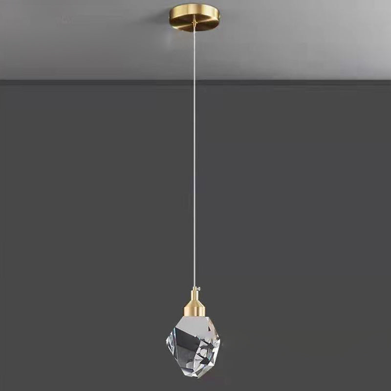 Crystal cube pendant light hung above bedroom nightstand — Casa Norex