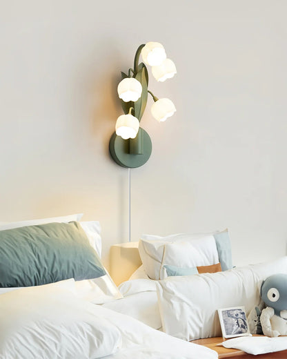 Bell Orchid sconce lit warm downward glow - Casa Norex