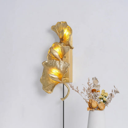 Ginkgo Leaf brass wall sconce warm glow interior - Casa Norex