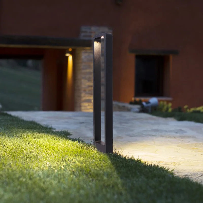 Solari bollard lights lining a garden walkway — Casa Norex