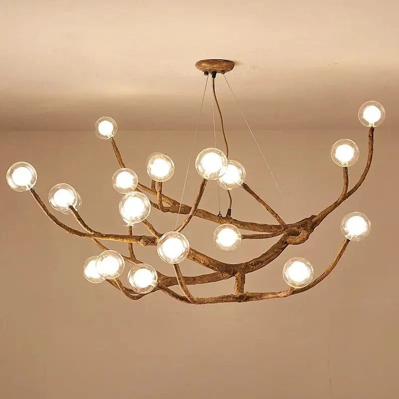 Tree chandelier in living room setting — warm glow | Casa Norex