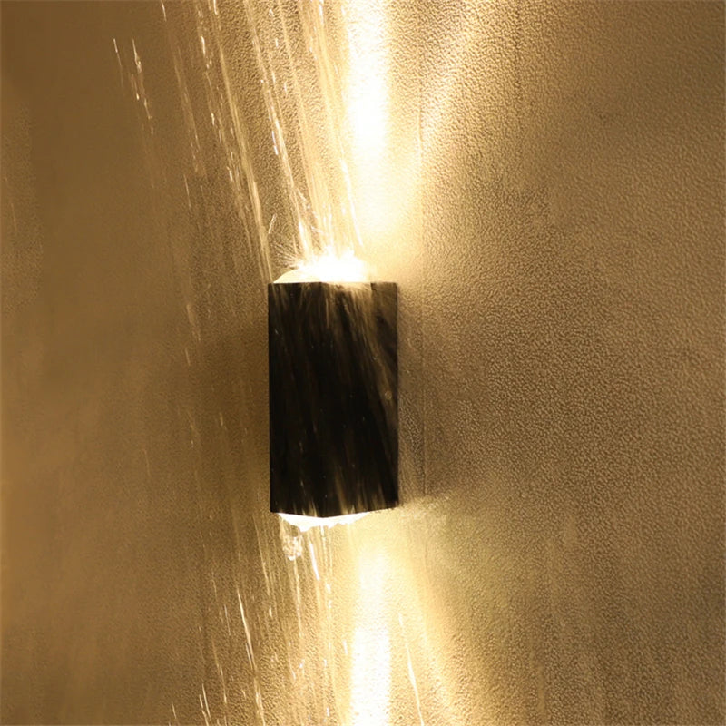 COB LED outdoor wall light mounted on porch wall — two-head beam pattern — Casa Norex