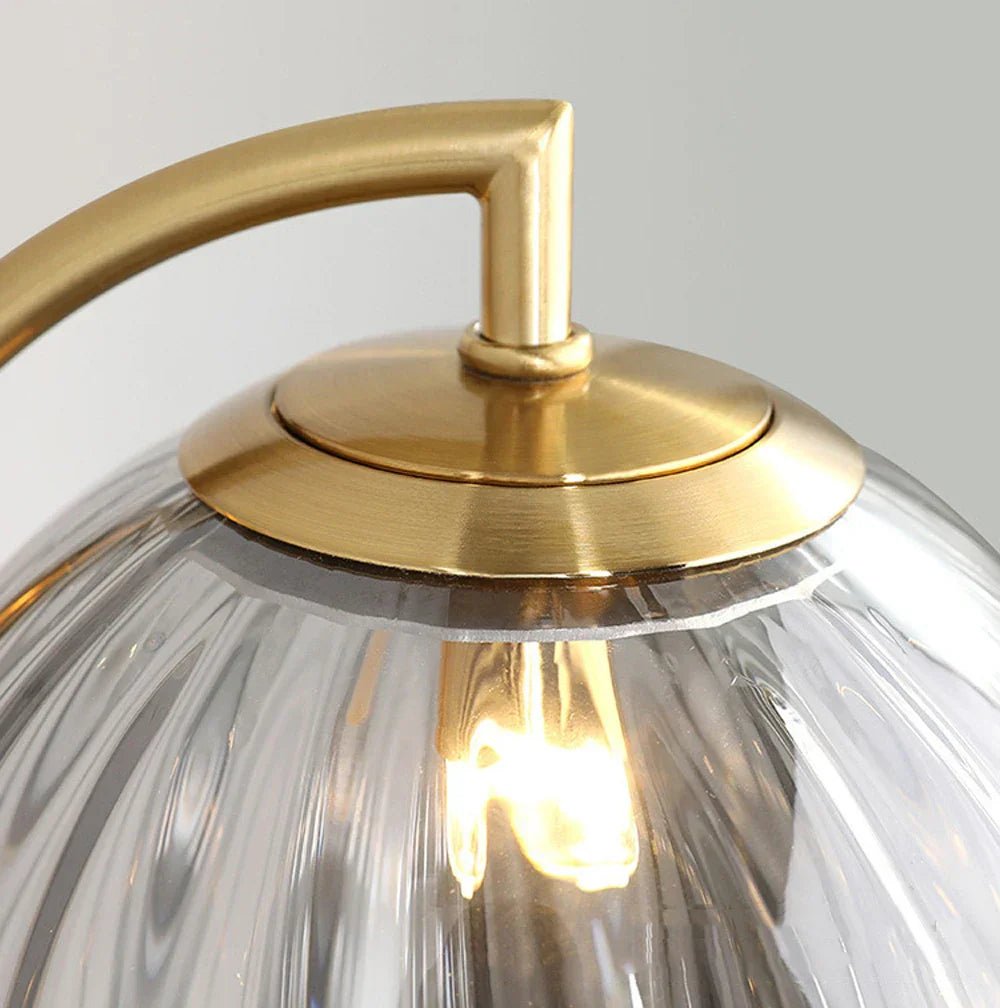Howard glass globe wall light - curved brass arm profile - Casa Norex