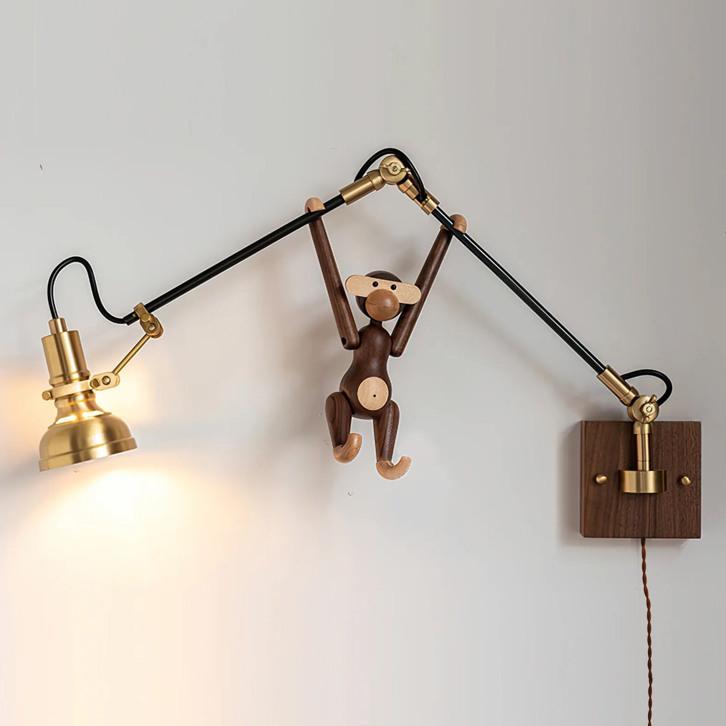 Brass pivot joint close-up - Kane plug-in swing arm sconce by Casa Norex