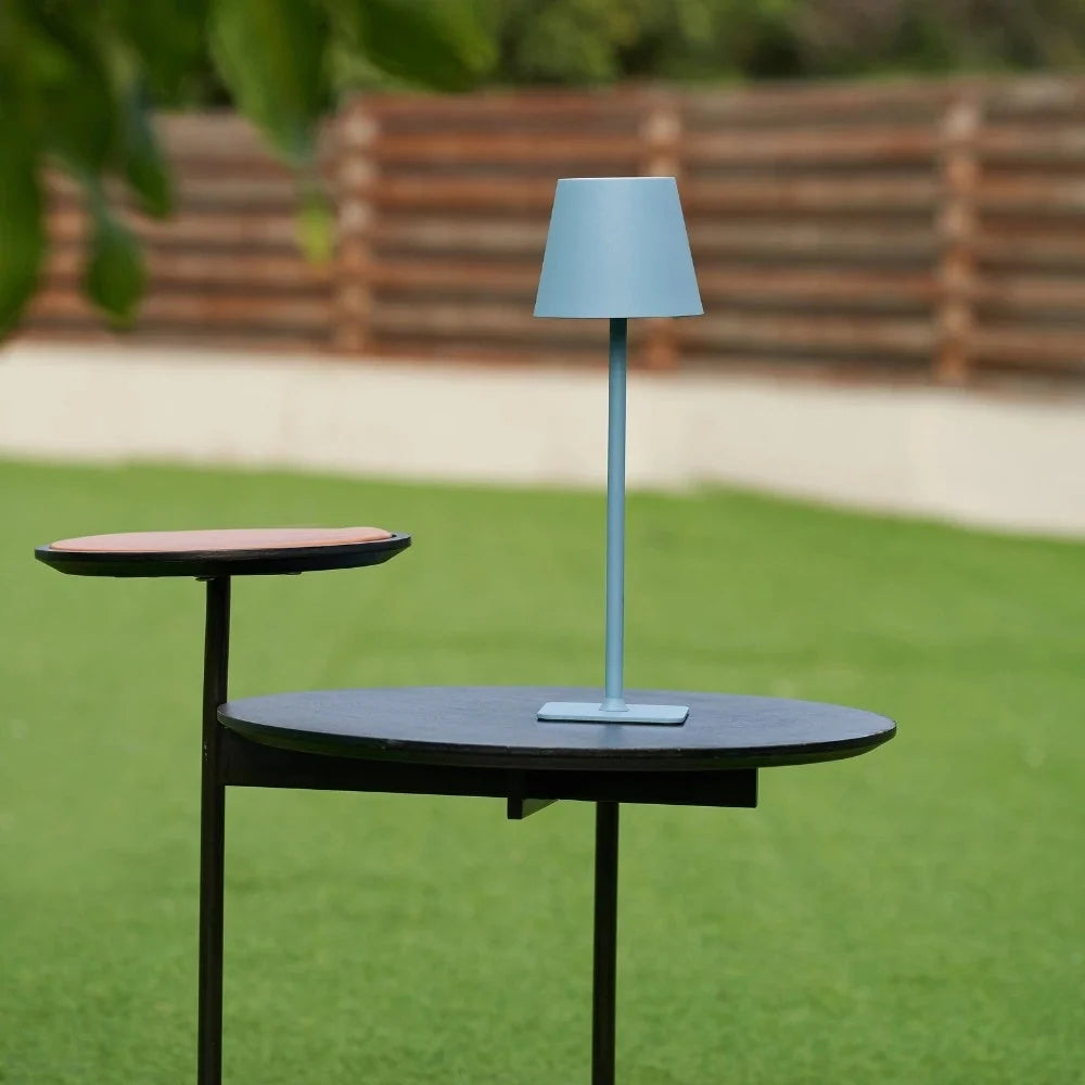 Matte blue table lamp on a garden table outdoors — Casa Norex