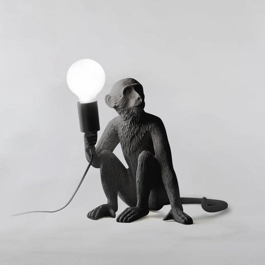 Monkey table lamp in modern living room setting — sculptural accent lighting | Casa Norex