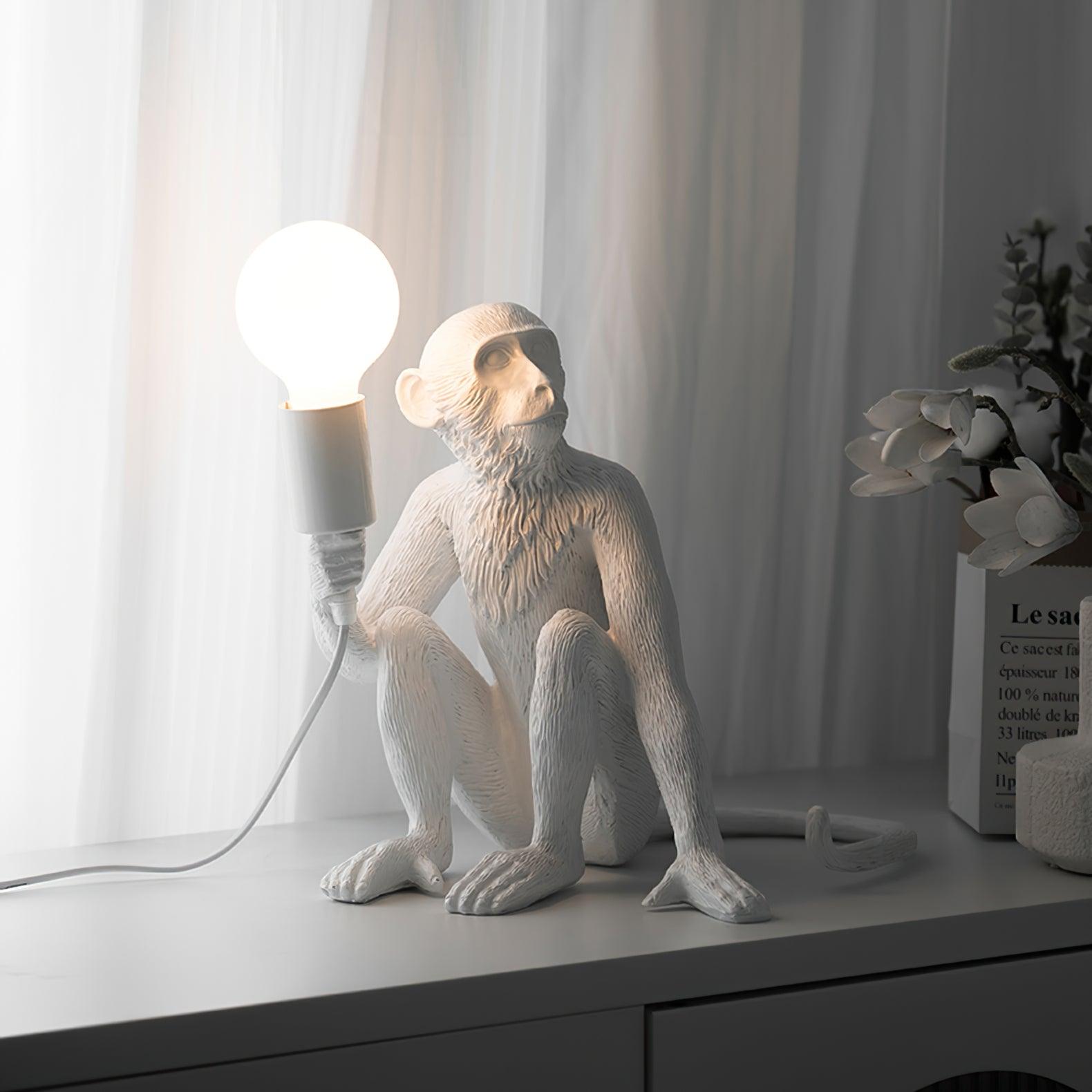 Resin monkey table lamp detail view — Casa Norex