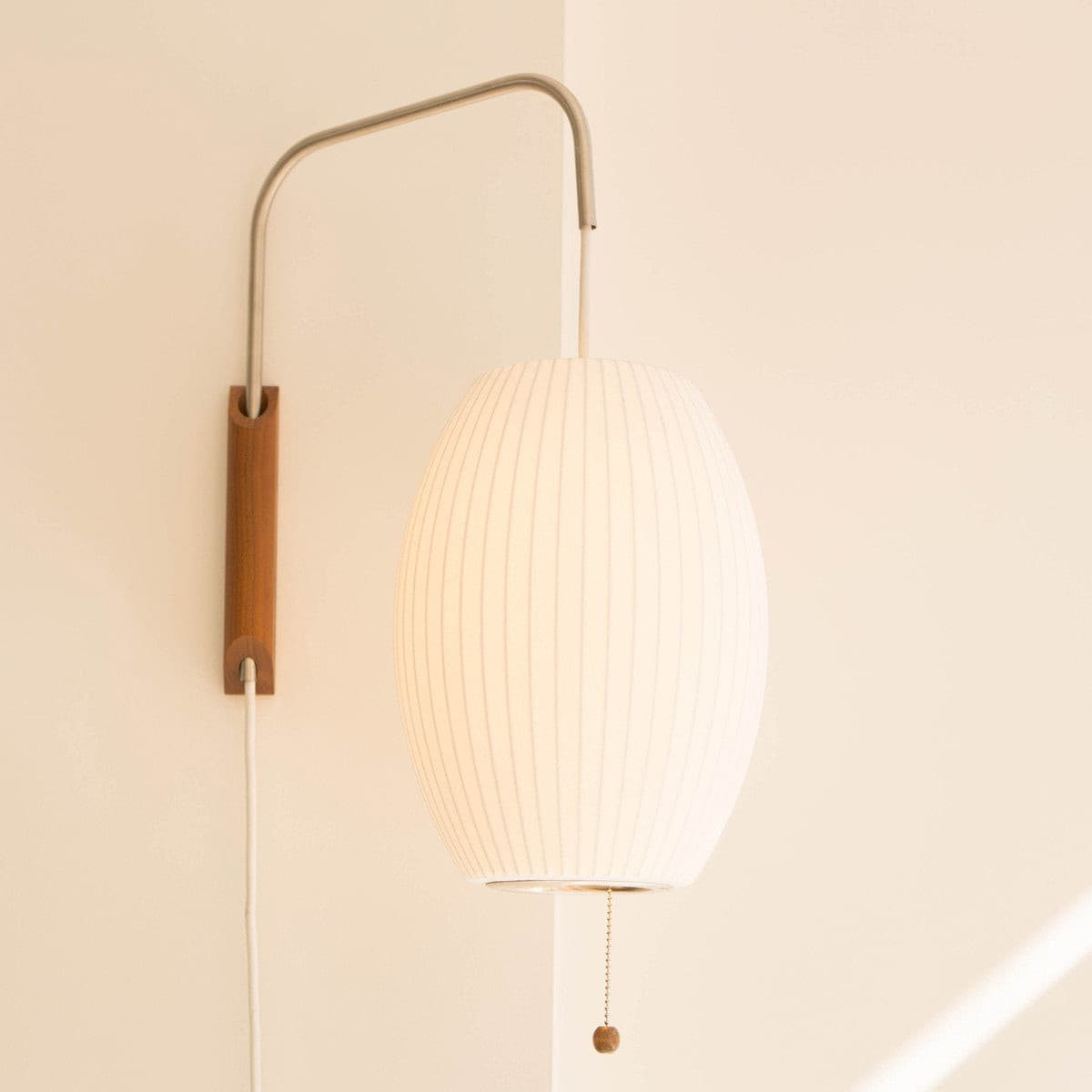 Nelson plug-in wall sconce installed living room - Casa Norex