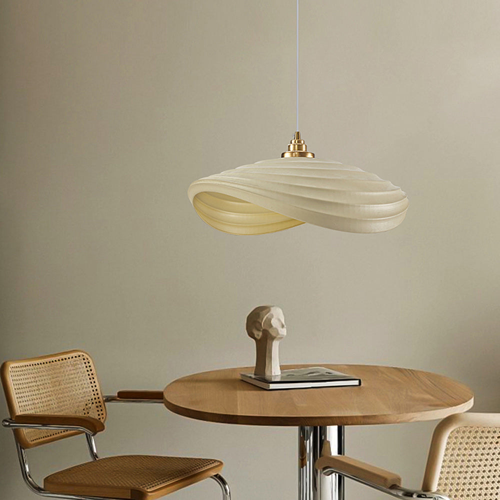 Unique pendant light in dining room setting — rippling ambient glow | Casa Norex