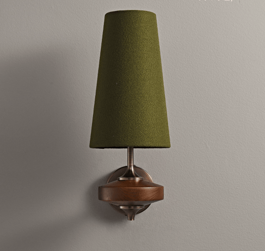 Wall sconce flanking bed in bedroom setting | Casa Norex