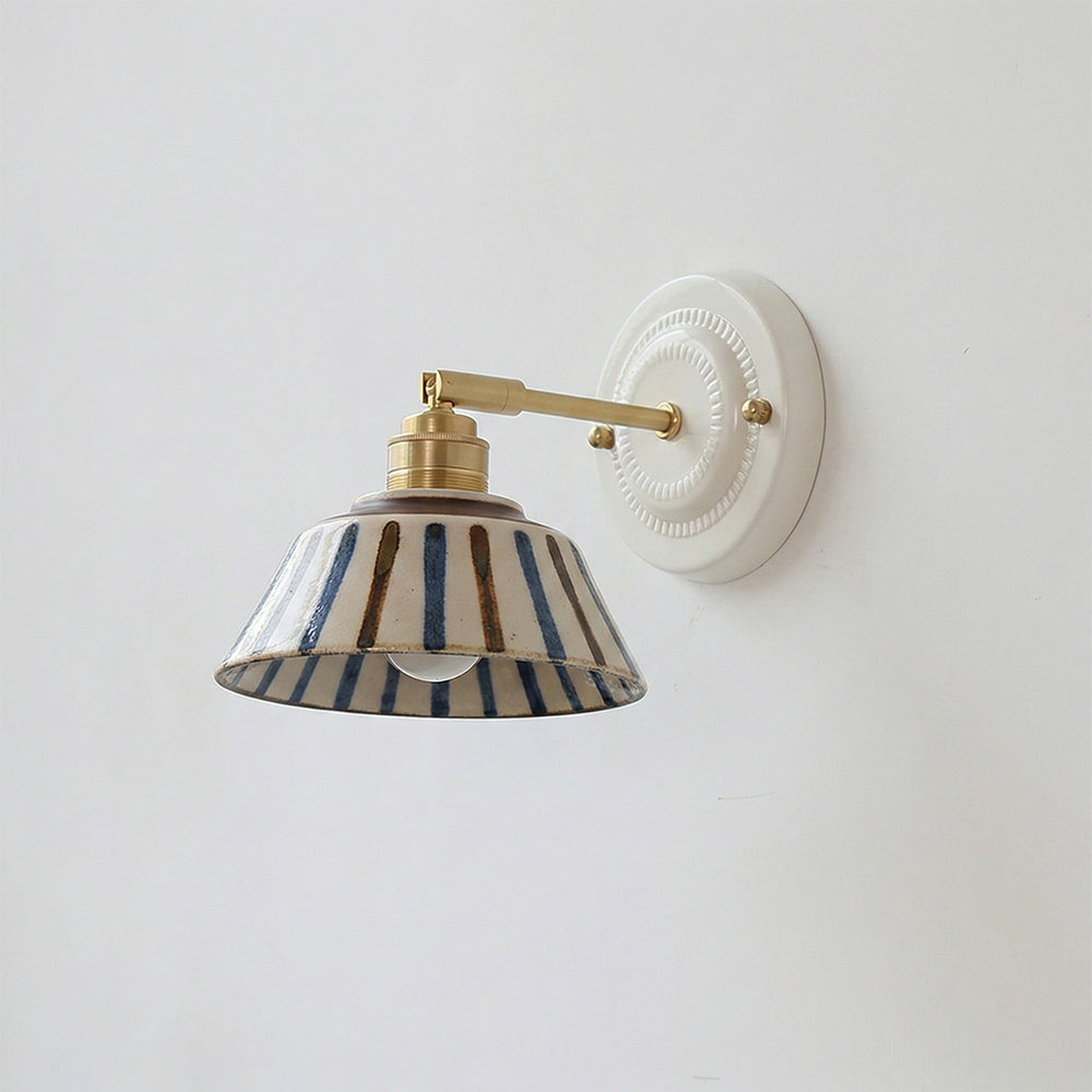 Wall sconce in bedroom setting — warm bedside light | Casa Norex