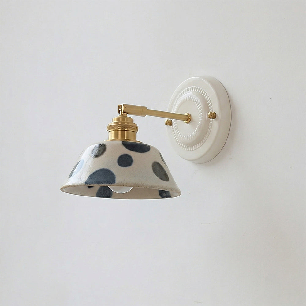 Close-up of hand-painted indigo motifs on ceramic wall sconce | Casa Norex