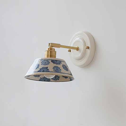 Hand-glazed ceramic wall sconce — brass hardware, indigo motifs | Casa Norex