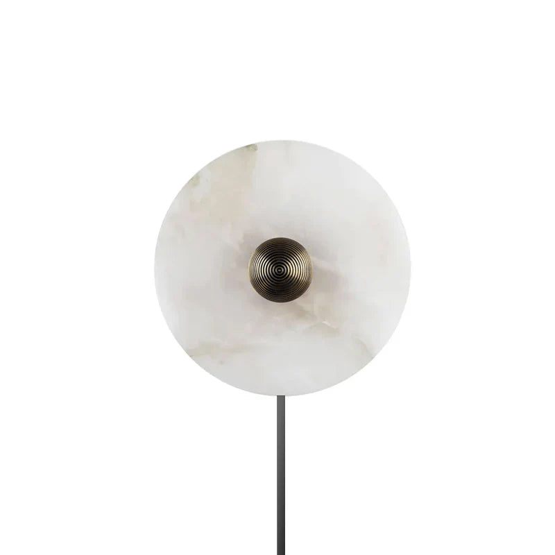 Round alabaster sconce in living room setting warm glow - Casa Norex