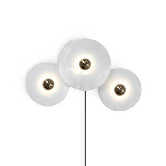 Alabaster combination sconces in modern living room - Casa Norex