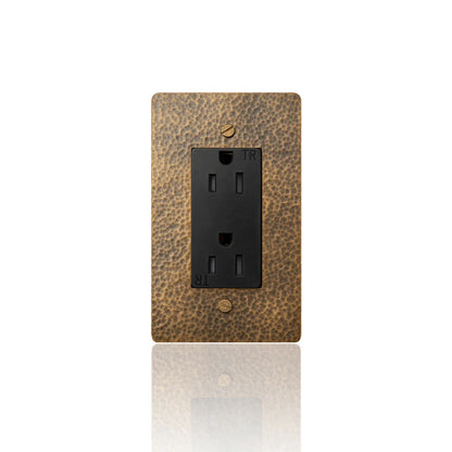Close-up of single 15A hammered brass wall outlet | Casa Norex