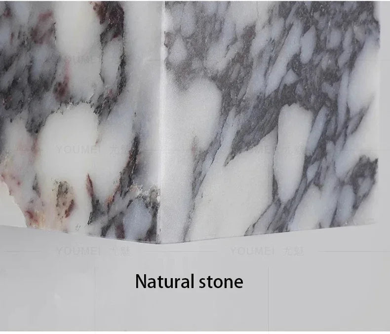 Marble wall sconce natural veining variation close-up | Casa Norex