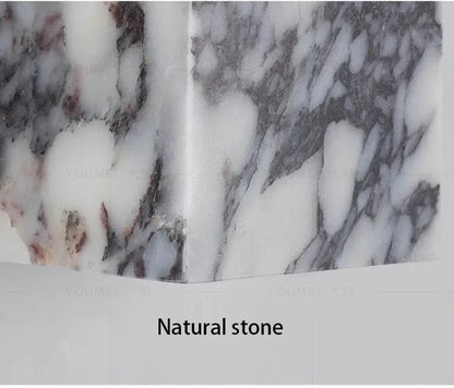 Marble wall sconce natural veining variation close-up | Casa Norex