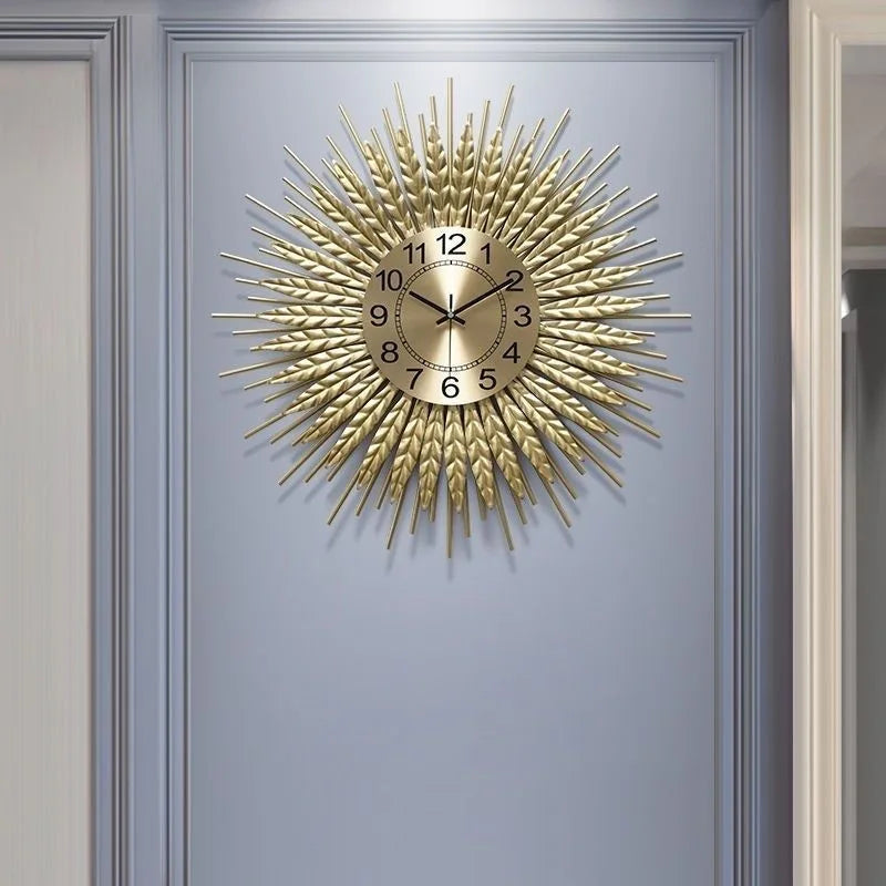 Close-up of gold iron sunburst frame with wheat-ear motif detail on wheat sunburst wall clock | Casa Norex
