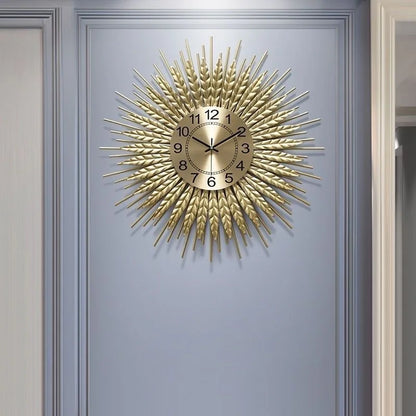 Close-up of gold iron sunburst frame with wheat-ear motif detail on wheat sunburst wall clock | Casa Norex