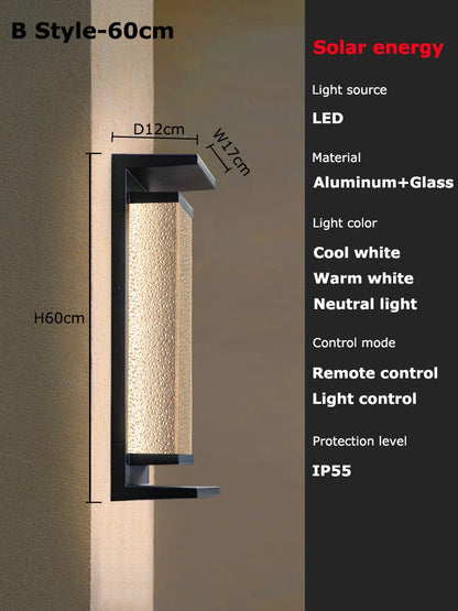 Solar dusk to dawn wall lantern in Black mounted on a wall