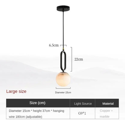 Marble pendant light — black and gold natural stone shade on polished copper | Casa Norex