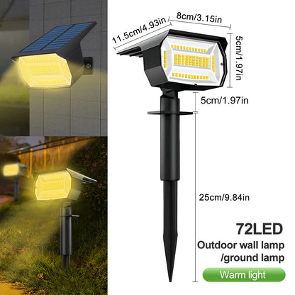 LED solar landscape spotlight staked into garden soil