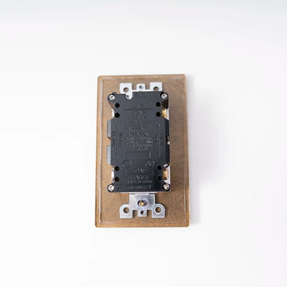 20A wall outlet panel texture close-up — Casa Norex